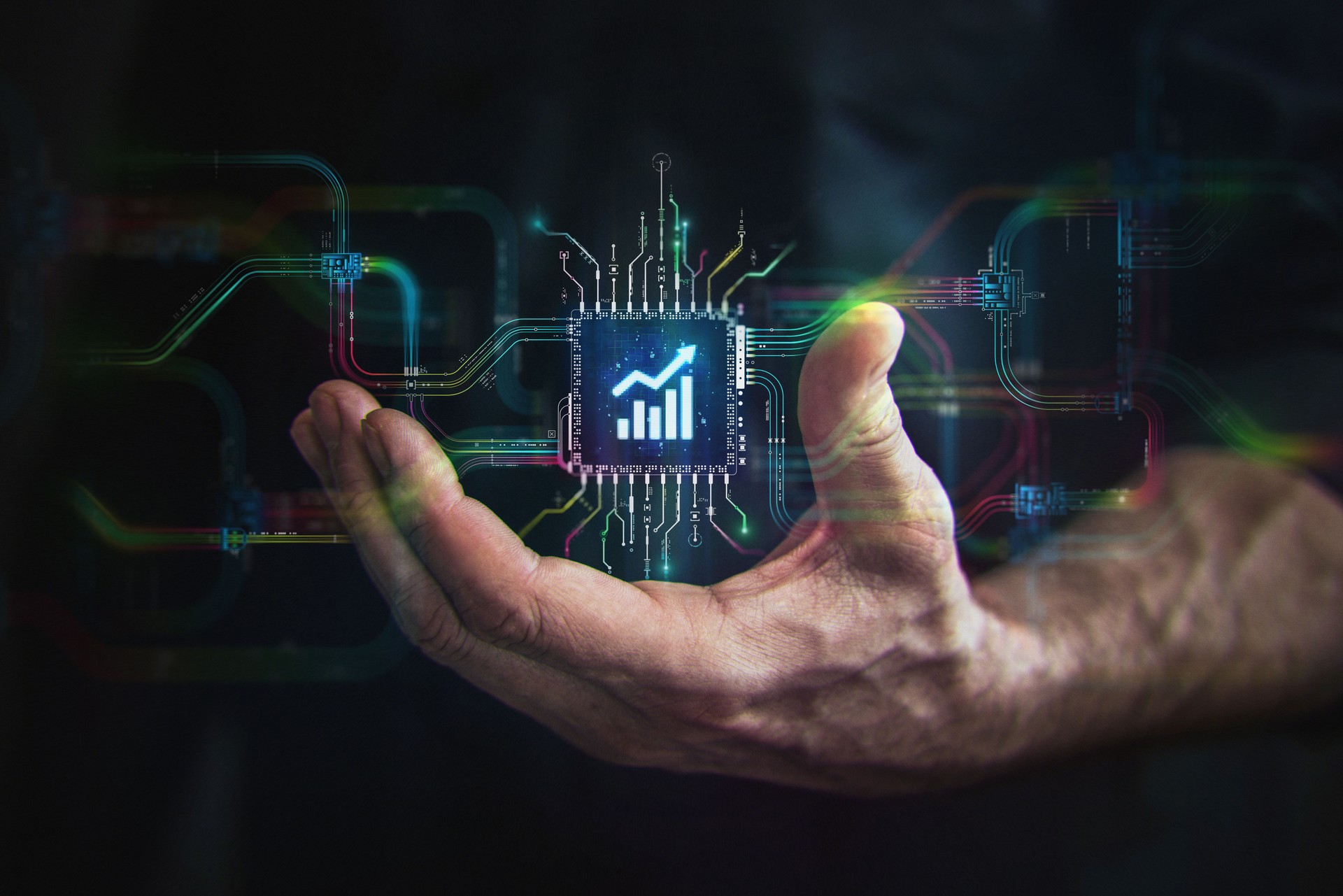 Successful trading technology in your hand. Male hand holding futuristic growing chart in the center and circuit board with vibrant data transfers, representing evolving trading technology of the future.